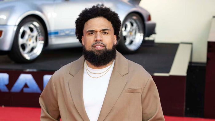 Steven Caple Jr. wearing ORTTU Naoki Jacket at Transformers NYC premiere