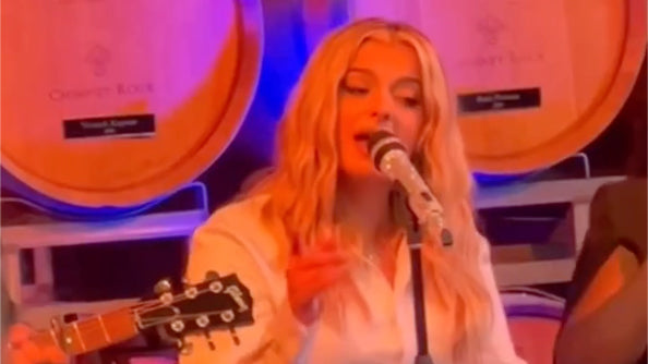 Bebe Rexha (wearing ORTTU) performing at Napa Valley’s  Live in the Vineyard festival.